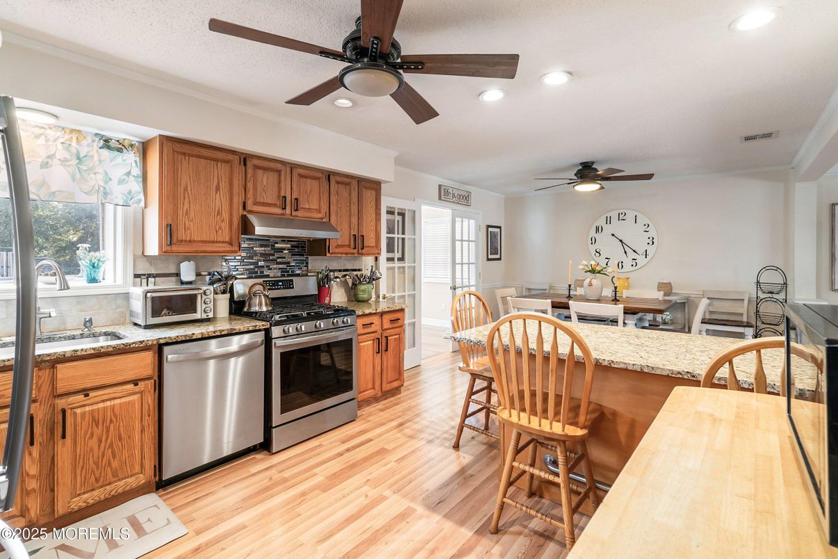 Dining room, Interior, Kitchen, Recessed Lighting, Stainless Steel Appliances, Wood Texture Flooring
