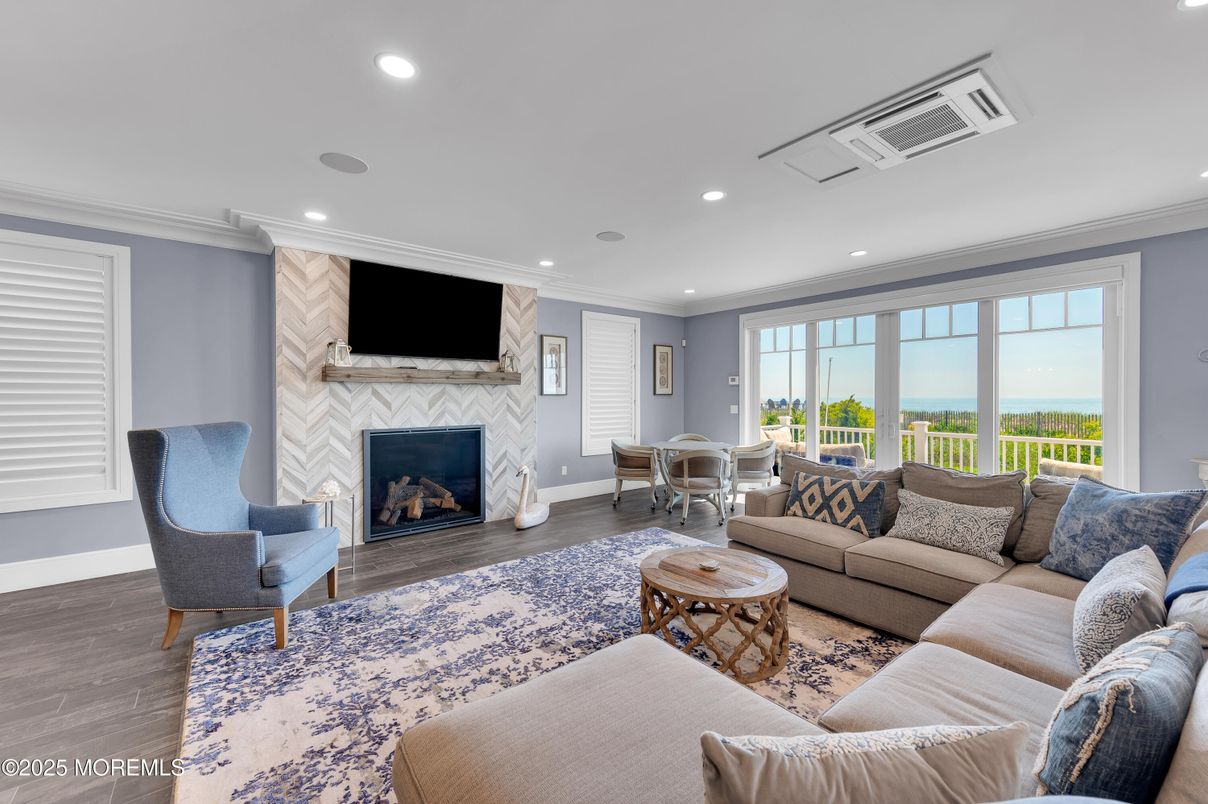 Dining room, Fireplace, Interior, Living room, Recessed Lighting, Water, Wood Texture Flooring