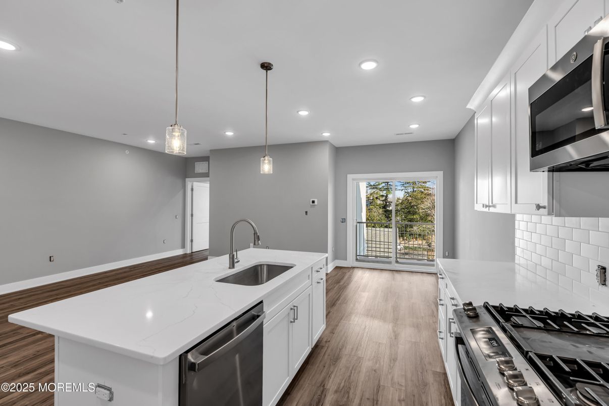 Interior, Kitchen, Pendant Lights, Recessed Lighting, Stainless Steel Appliances, Wood Texture Flooring