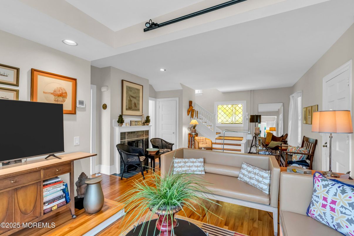 Dining room, Fireplace, Interior, Living room, Recessed Lighting, Wood Texture Flooring