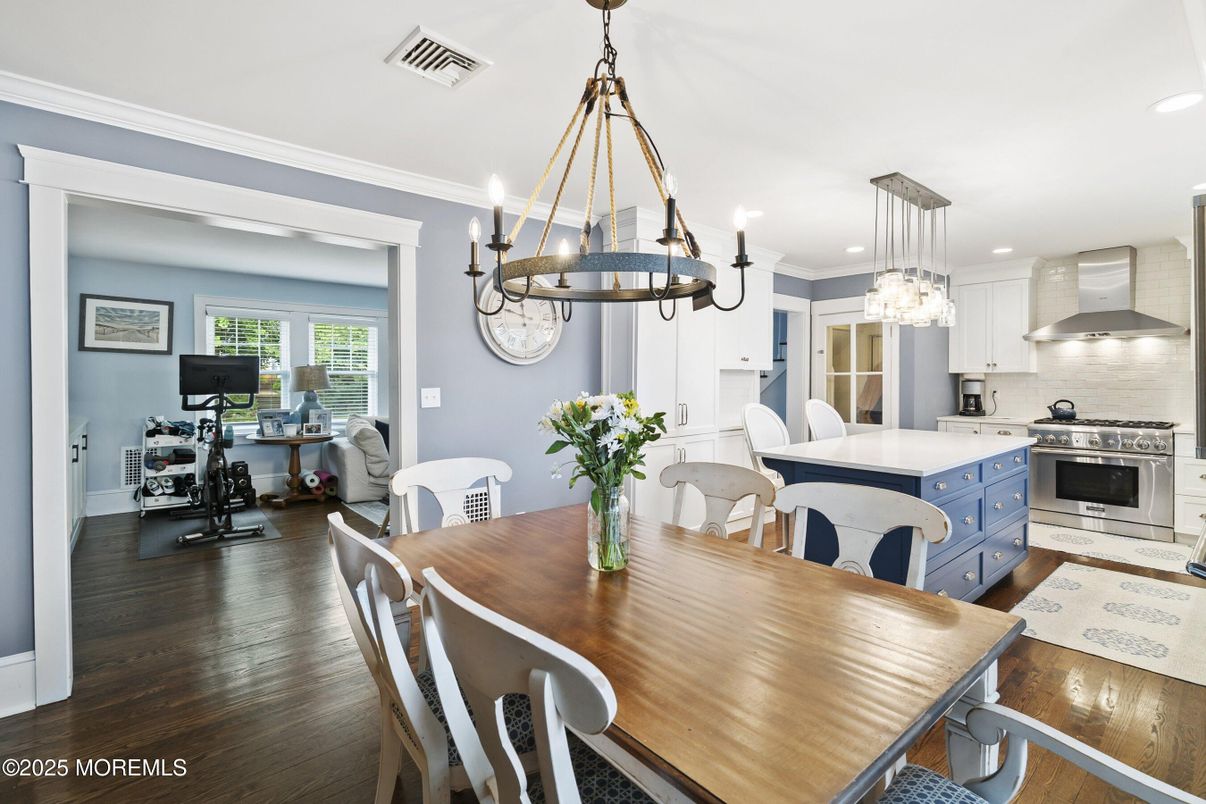 Chandelier, Dining room, Fitness Equipment, Interior, Kitchen, Pendant Lights, Recessed Lighting, Stainless Steel Appliances, Wood Texture Flooring