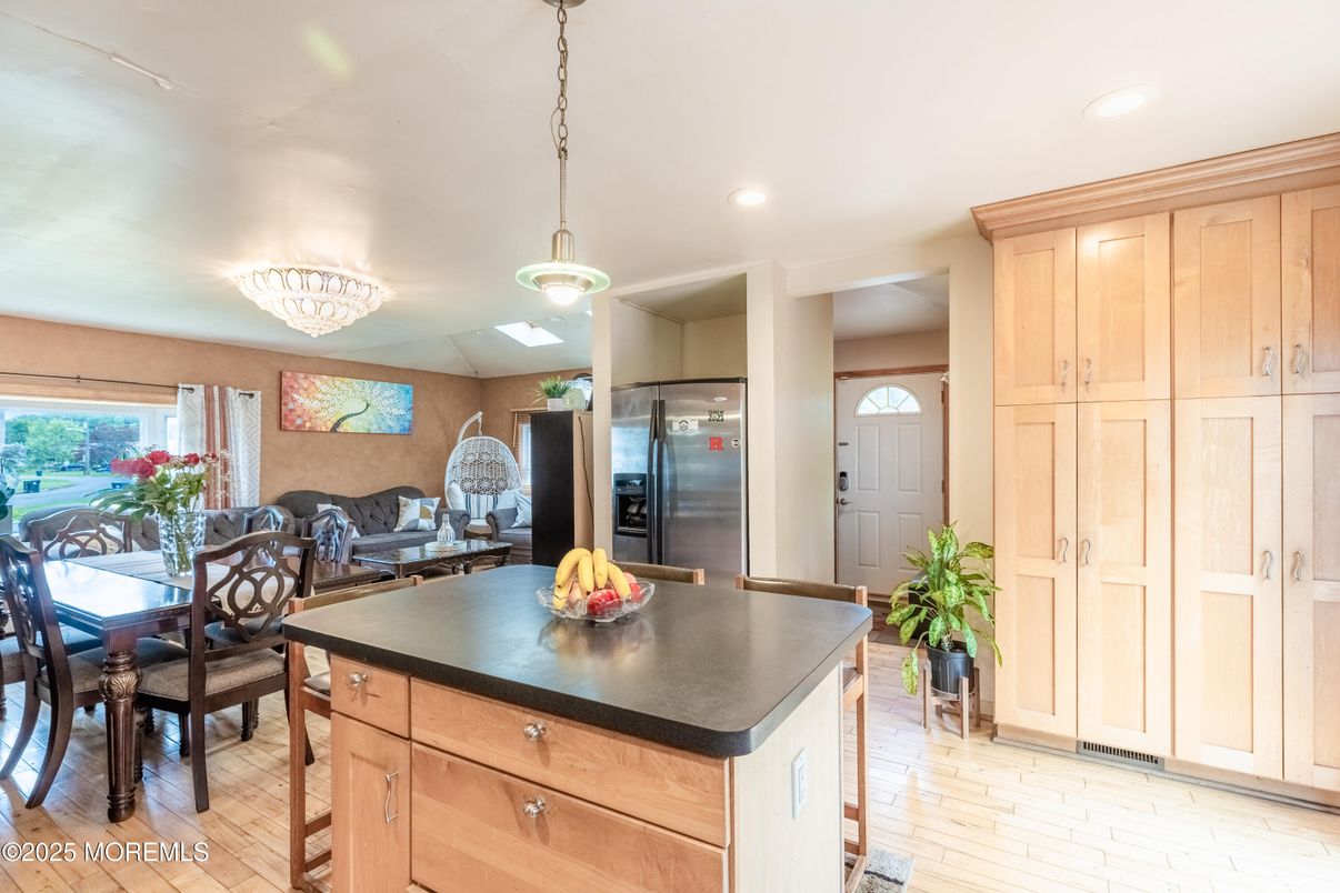 Chandelier, Dining room, Interior, Kitchen, Pendant Lights, Recessed Lighting, Stainless Steel Appliances, Wood Texture Flooring