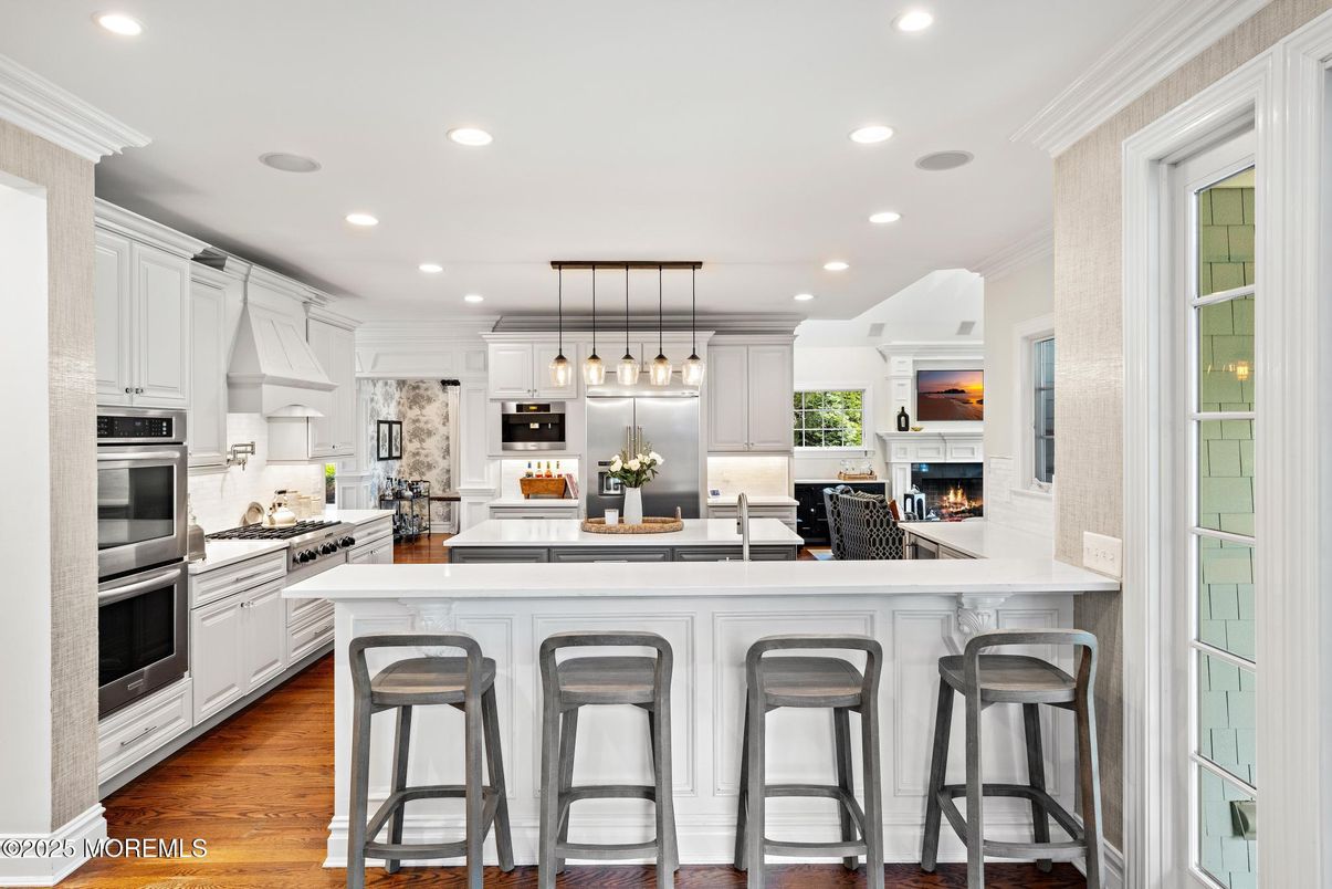 Fireplace, Interior, Kitchen, Pendant Lights, Recessed Lighting, Stainless Steel Appliances, Wood Texture Flooring