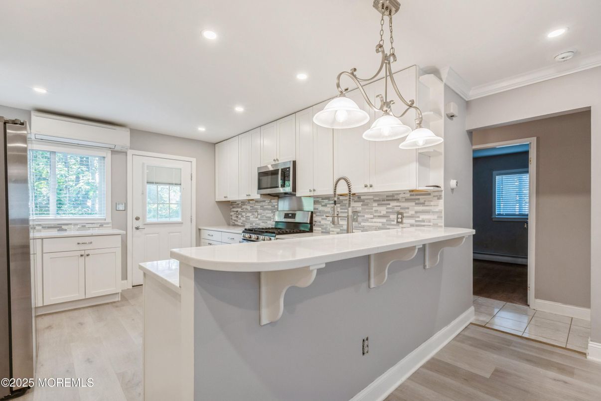 Interior, Kitchen, Pendant Lights, Recessed Lighting, Stainless Steel Appliances, Wood Texture Flooring