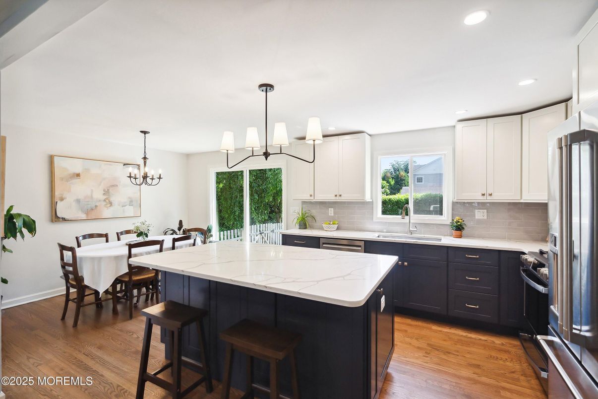 Chandelier, Dining room, Interior, Kitchen, Recessed Lighting, Stainless Steel Appliances, Wood Texture Flooring