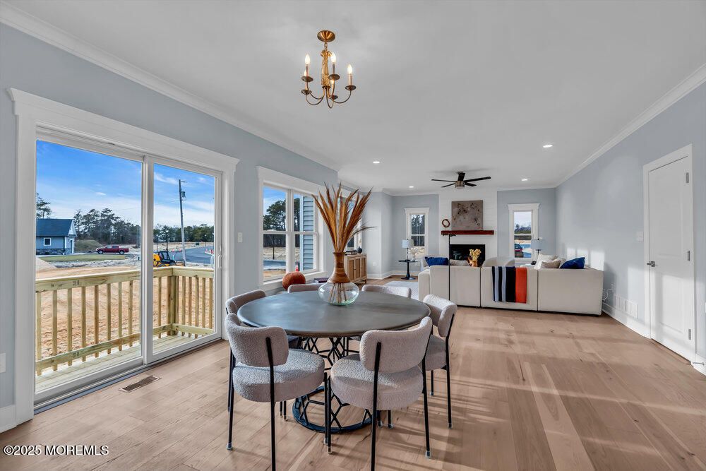 Chandelier, Dining room, Fireplace, Interior, Living room, Recessed Lighting, Wood Texture Flooring