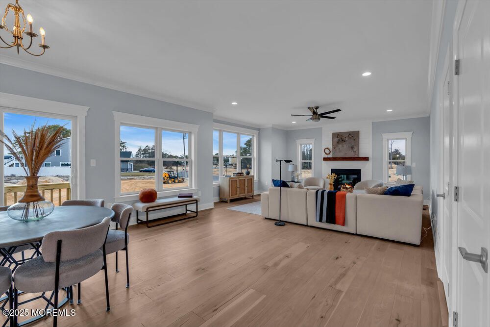Dining room, Fireplace, Interior, Living room, Recessed Lighting, Wood Texture Flooring