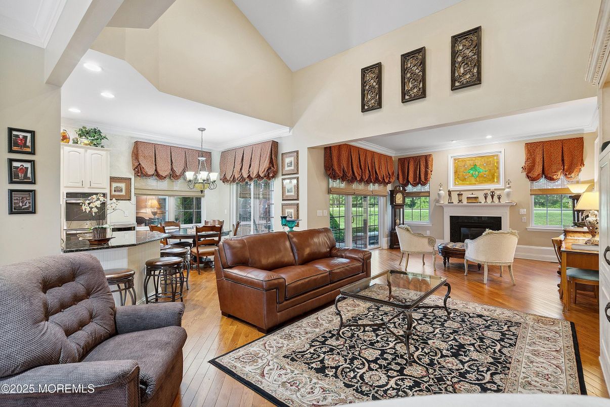 Chandelier, Dining room, Fireplace, Interior, Kitchen, Living room, Recessed Lighting, Wood Texture Flooring