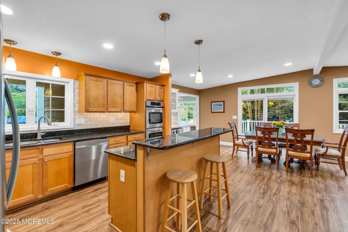 Dining room, Interior, Kitchen, Pendant Lights, Recessed Lighting, Stainless Steel Appliances, Wood Texture Flooring