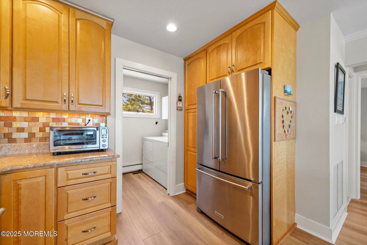 Interior, Kitchen, Recessed Lighting, Washer, Wood Texture Flooring