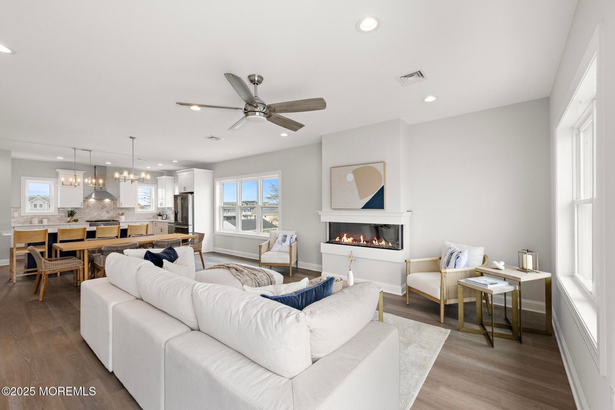 Dining room, Fireplace, Interior, Kitchen, Living room, Pendant Lights, Recessed Lighting, Stainless Steel Appliances, Wood Texture Flooring