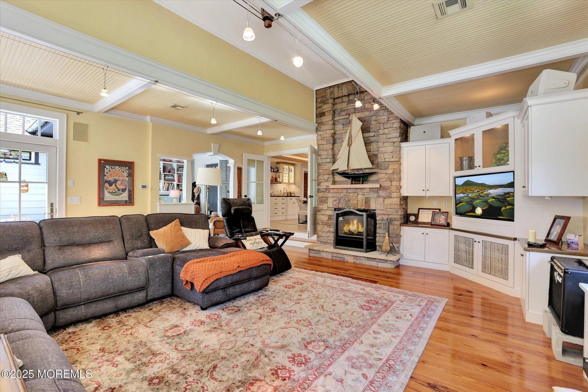 Fireplace, Interior, Living room, Pendant Lights, Recessed Lighting, Stone Walls, Wood Texture Flooring