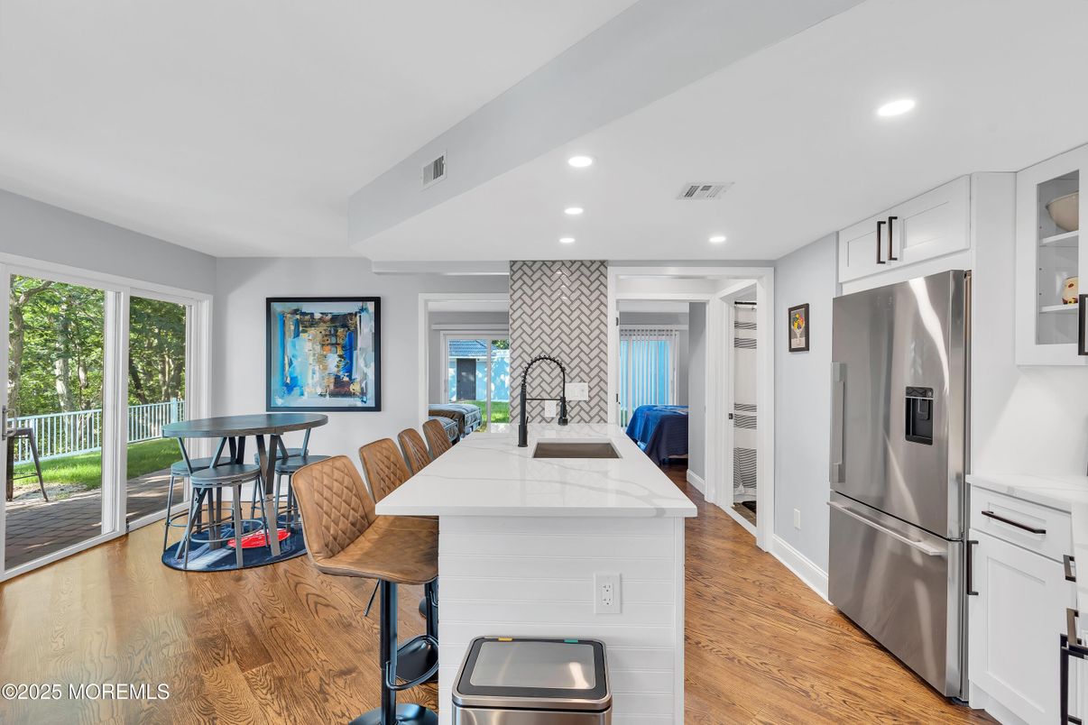 Dining room, Interior, Kitchen, Recessed Lighting, Stainless Steel Appliances, Wood Texture Flooring