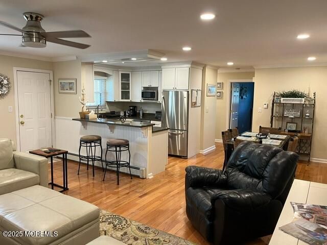 Dining room, Interior, Kitchen, Living room, Recessed Lighting, Stainless Steel Appliances, Wood Texture Flooring