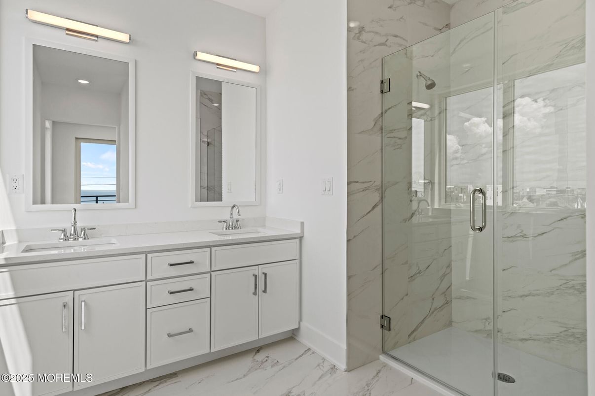 Bathroom, Dual Sink Vanities, Glass Shower, Interior, Marble, Marble Walls, Recessed Lighting