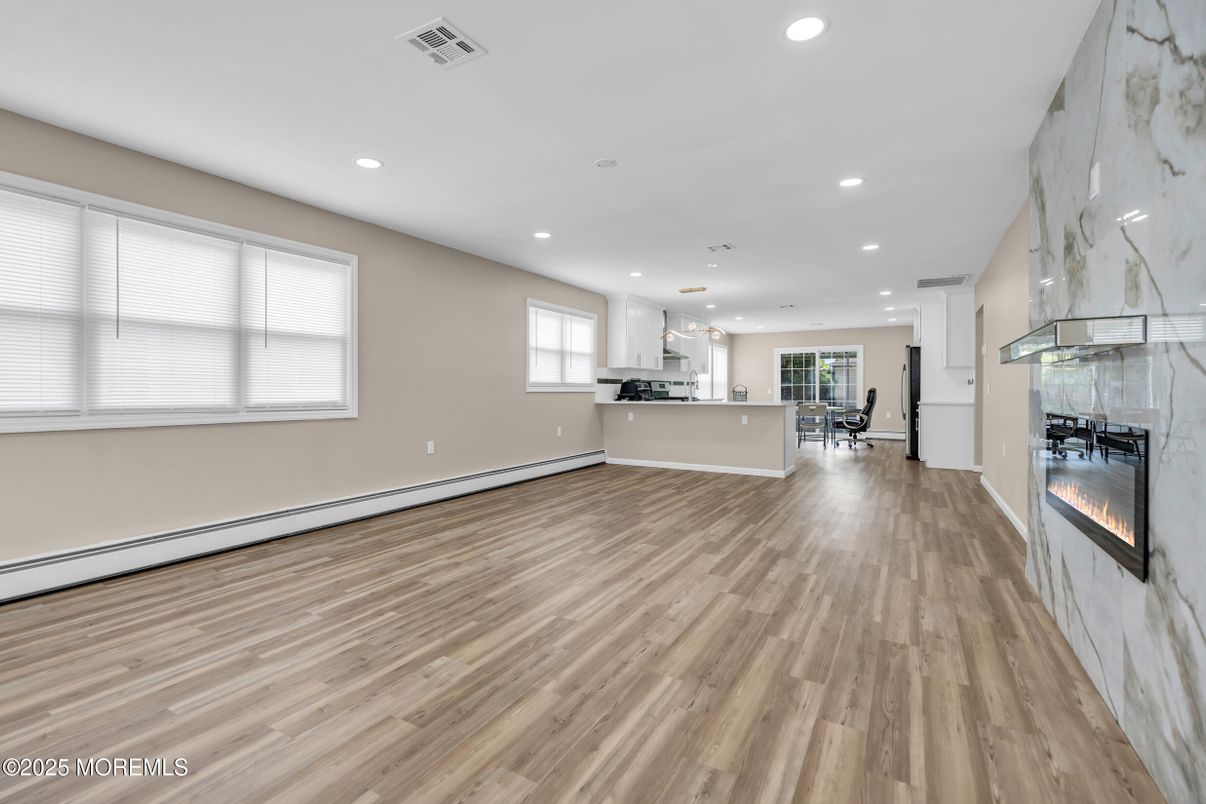 Dining room, Fireplace, Interior, Kitchen, Marble Walls, Pendant Lights, Recessed Lighting, Wood Texture Flooring