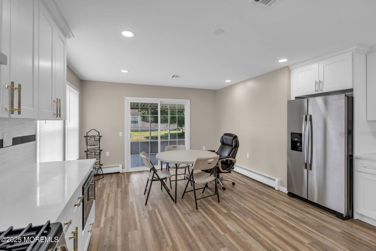 Dining room, Interior, Kitchen, Recessed Lighting, Stainless Steel Appliances, Wood Texture Flooring