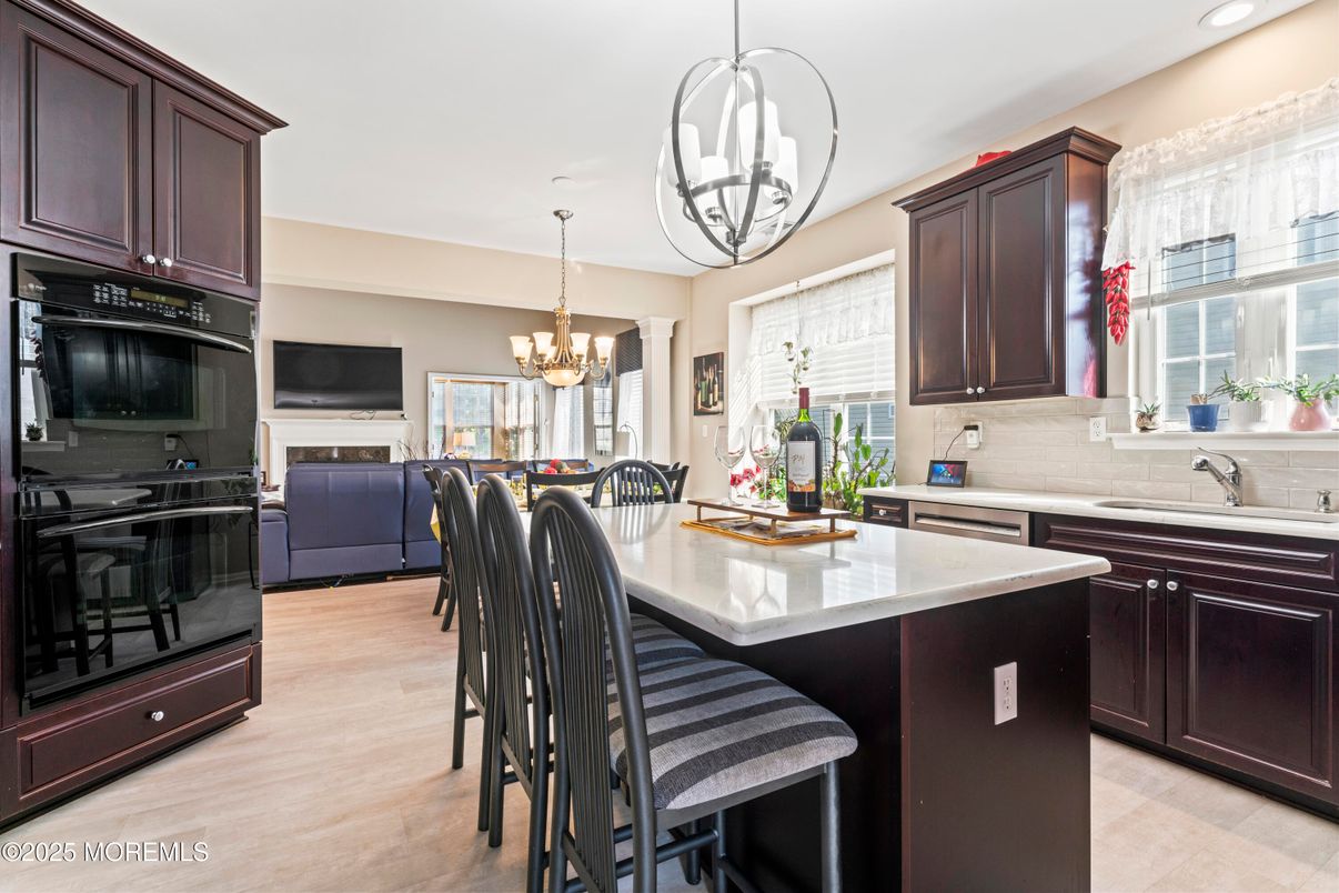 Chandelier, Dining room, Interior, Kitchen, Living room, Pendant Lights, Recessed Lighting, Wood Texture Flooring