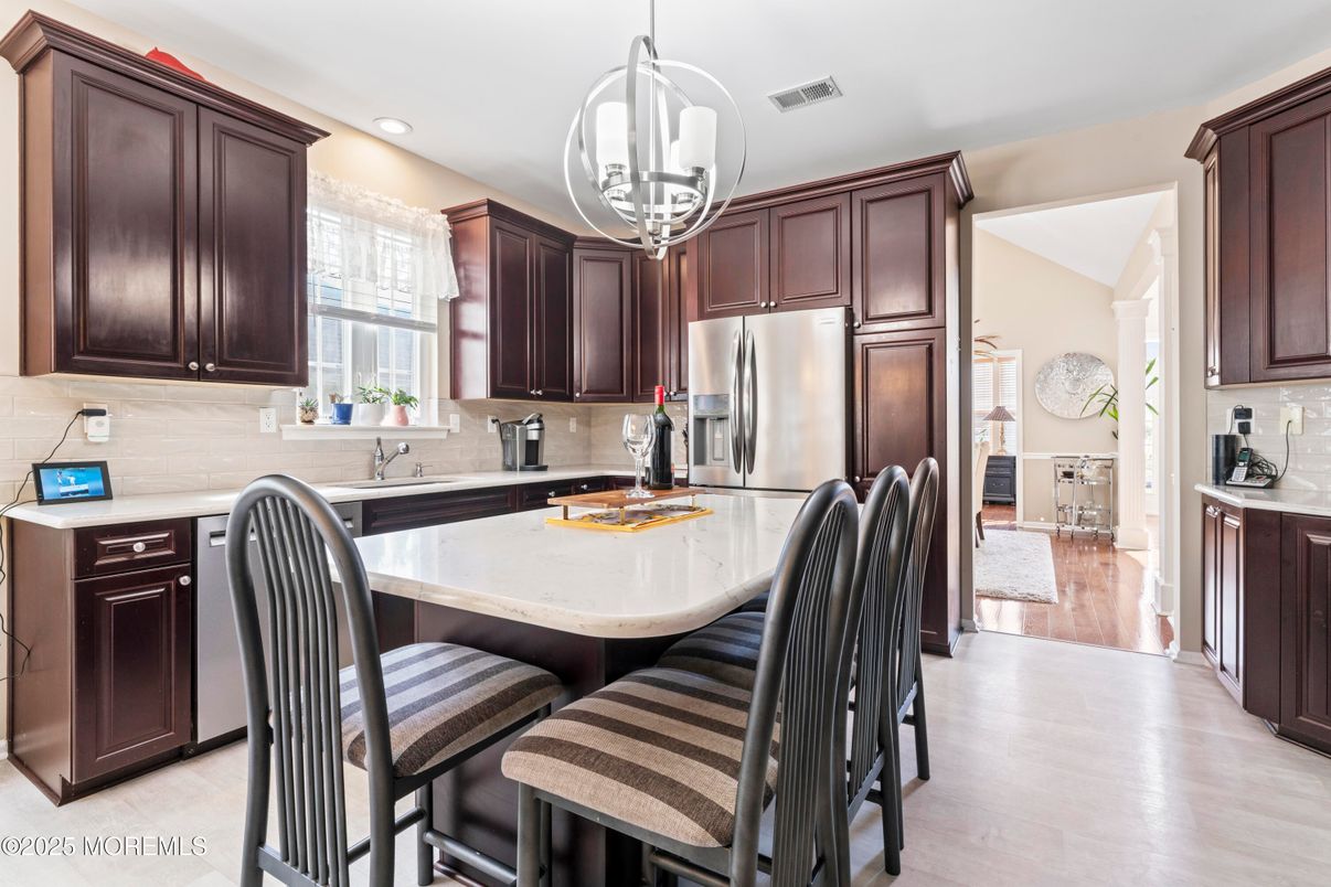 Dining room, Interior, Kitchen, Pendant Lights, Recessed Lighting, Stainless Steel Appliances, Wood Texture Flooring