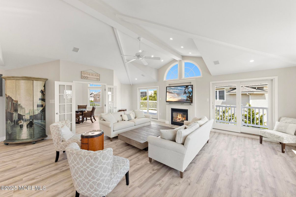 Dining room, Fireplace, Interior, Living room, Recessed Lighting, Wood Texture Flooring