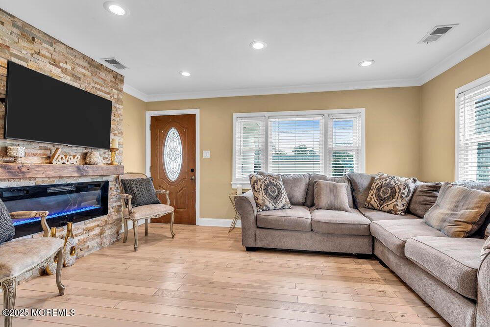 Fireplace, Interior, Living room, Recessed Lighting, Stone Walls, Wood Texture Flooring