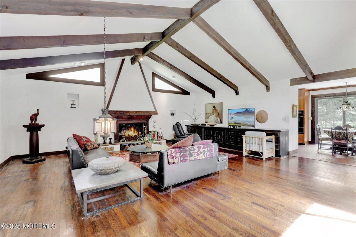 Dining room, Fireplace, Interior, Living room, Pendant Lights, Wooden Beams, Wood Texture Flooring