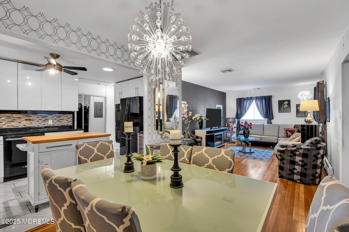 Chandelier, Dining room, Interior, Kitchen, Living room, Recessed Lighting, Stainless Steel Appliances, Wood Texture Flooring