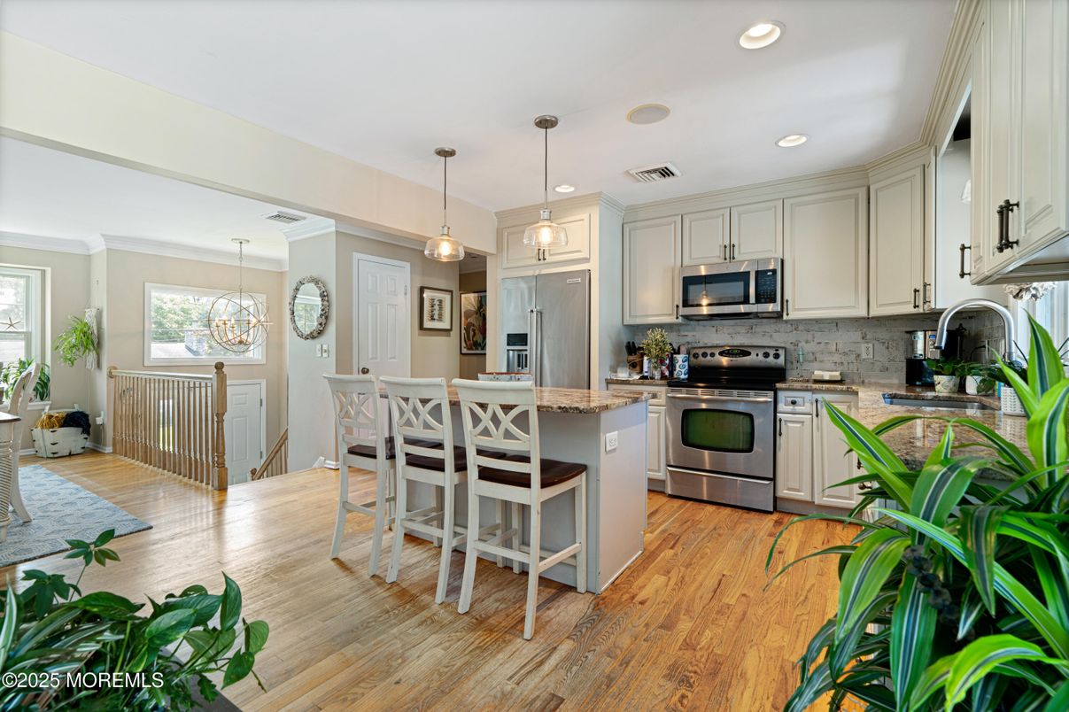Dining room, Interior, Kitchen, Pendant Lights, Recessed Lighting, Stainless Steel Appliances, Wood Texture Flooring