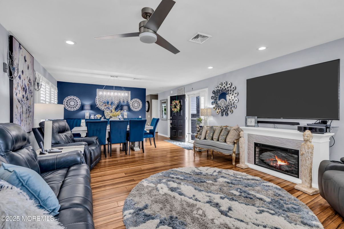 Dining room, Fireplace, Interior, Living room, Pendant Lights, Recessed Lighting, Wood Texture Flooring