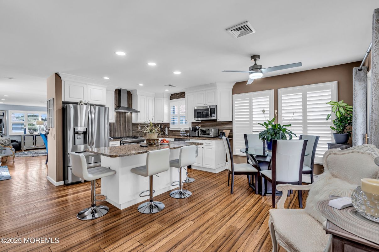 Dining room, Interior, Kitchen, Recessed Lighting, Stainless Steel Appliances, Wood Texture Flooring