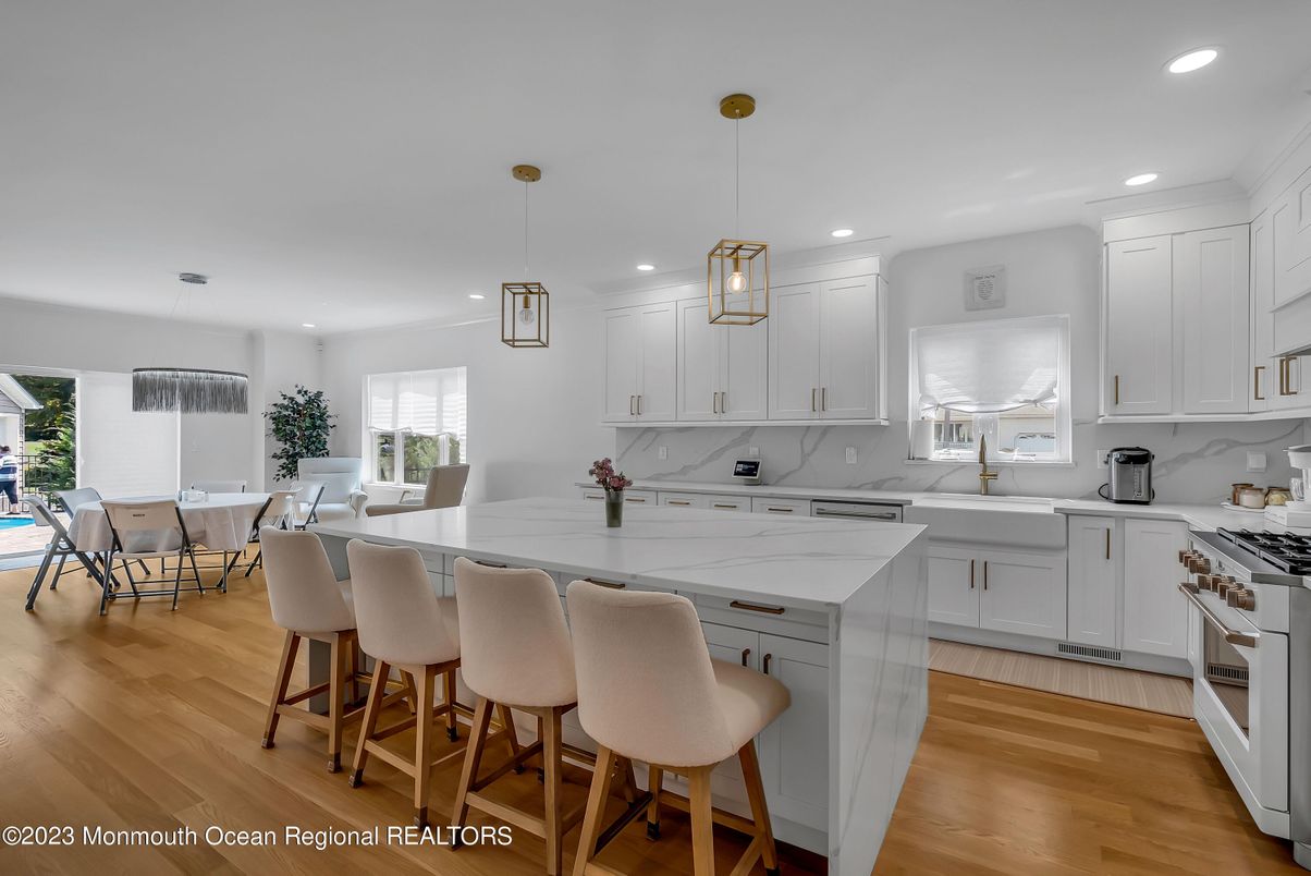 Dining room, Interior, Kitchen, Pendant Lights, Recessed Lighting, Stainless Steel Appliances, Wood Texture Flooring