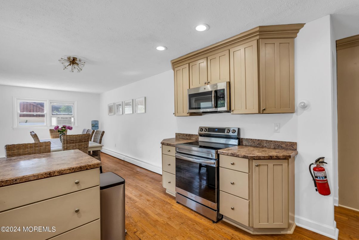 Dining room, Interior, Kitchen, Recessed Lighting, Stainless Steel Appliances, Wood Texture Flooring