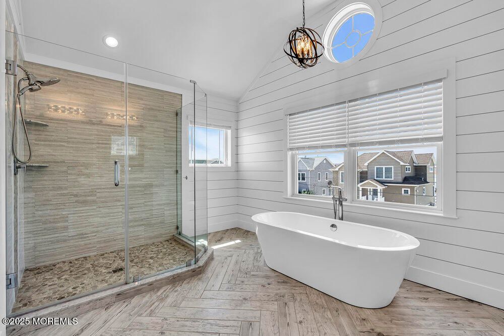 Bathroom, Free Standing Baths, Glass Shower, Interior, Pendant Lights, Recessed Lighting, Wood Texture Flooring