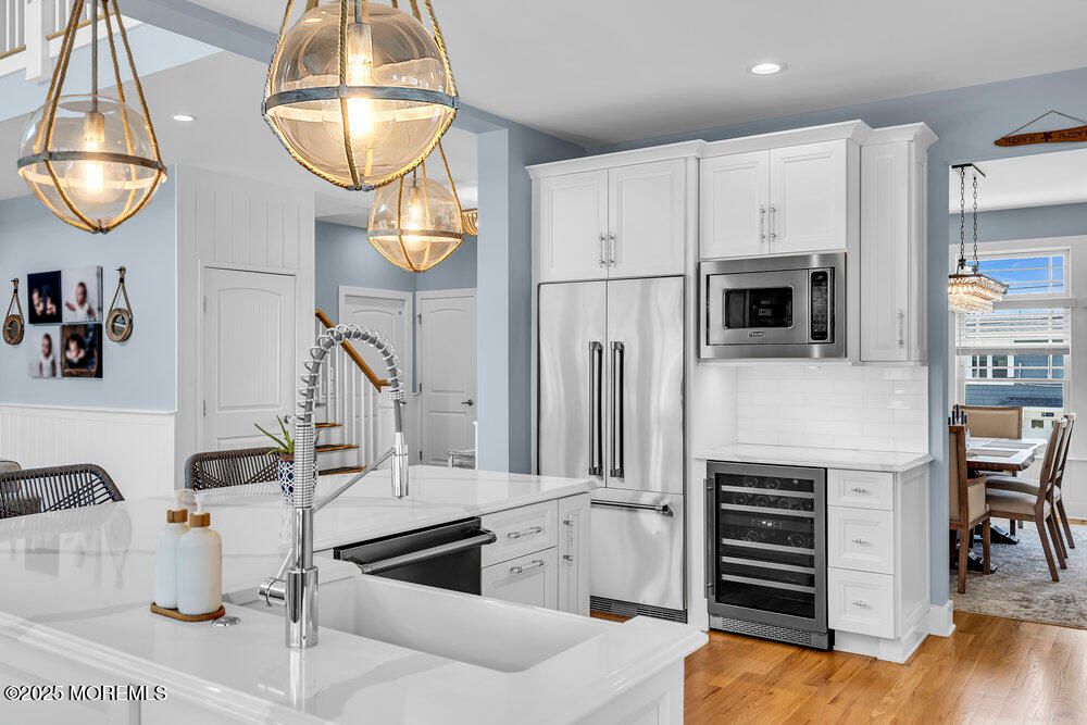 Dining room, Interior, Kitchen, Pendant Lights, Recessed Lighting, Stainless Steel Appliances, Wood Texture Flooring