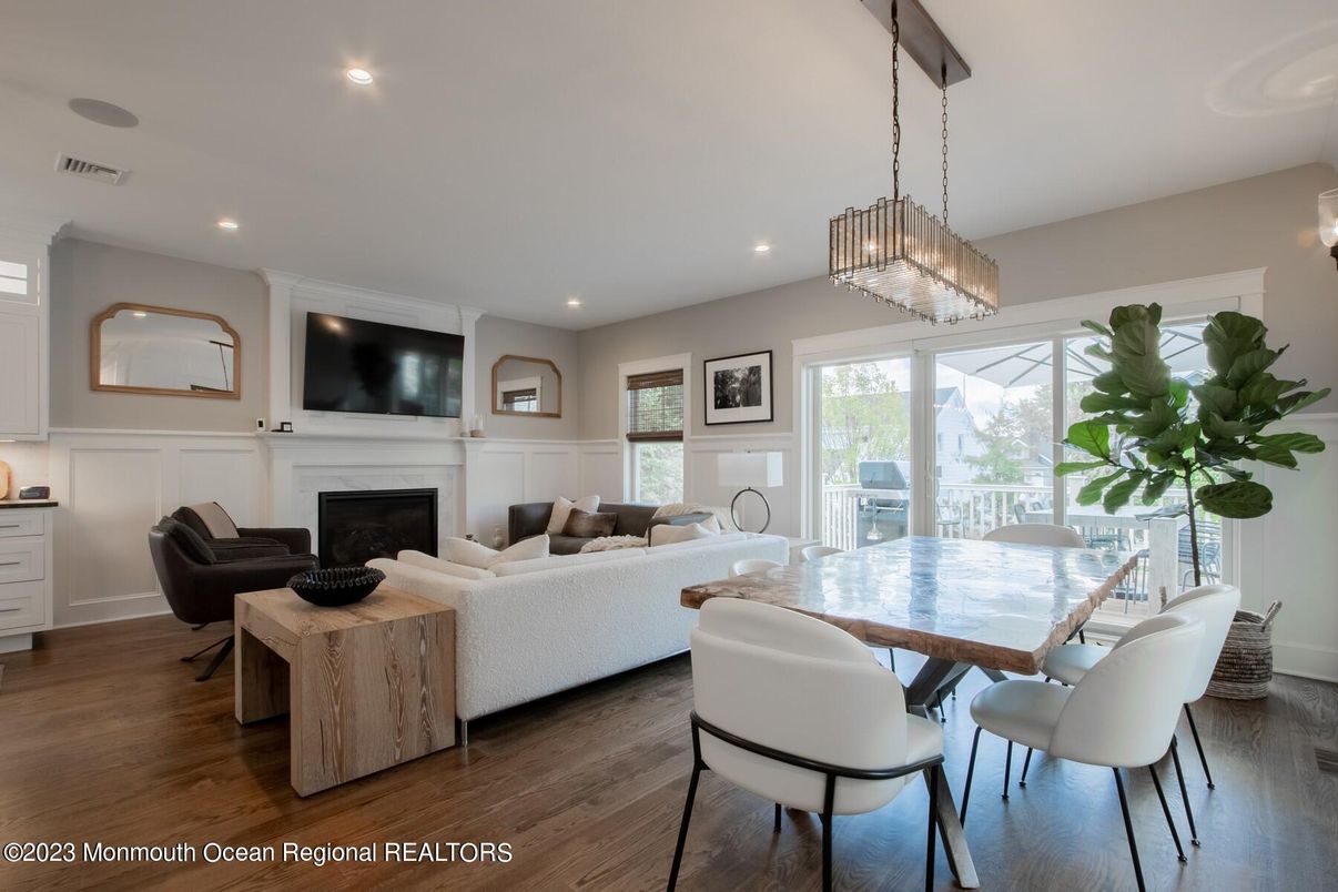 Chandelier, Dining room, Fireplace, Interior, Living room, Recessed Lighting, Wood Texture Flooring