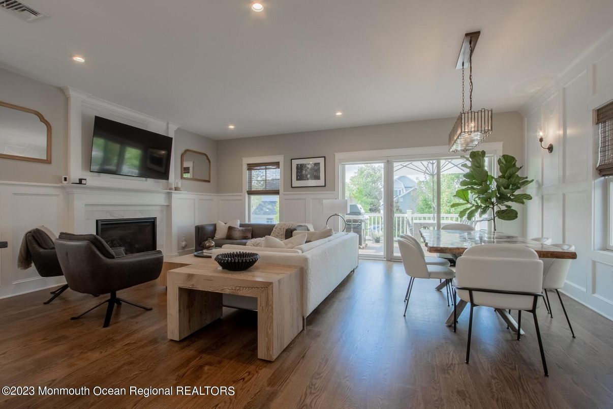 Dining room, Fireplace, Interior, Living room, Pendant Lights, Recessed Lighting, Wood Texture Flooring