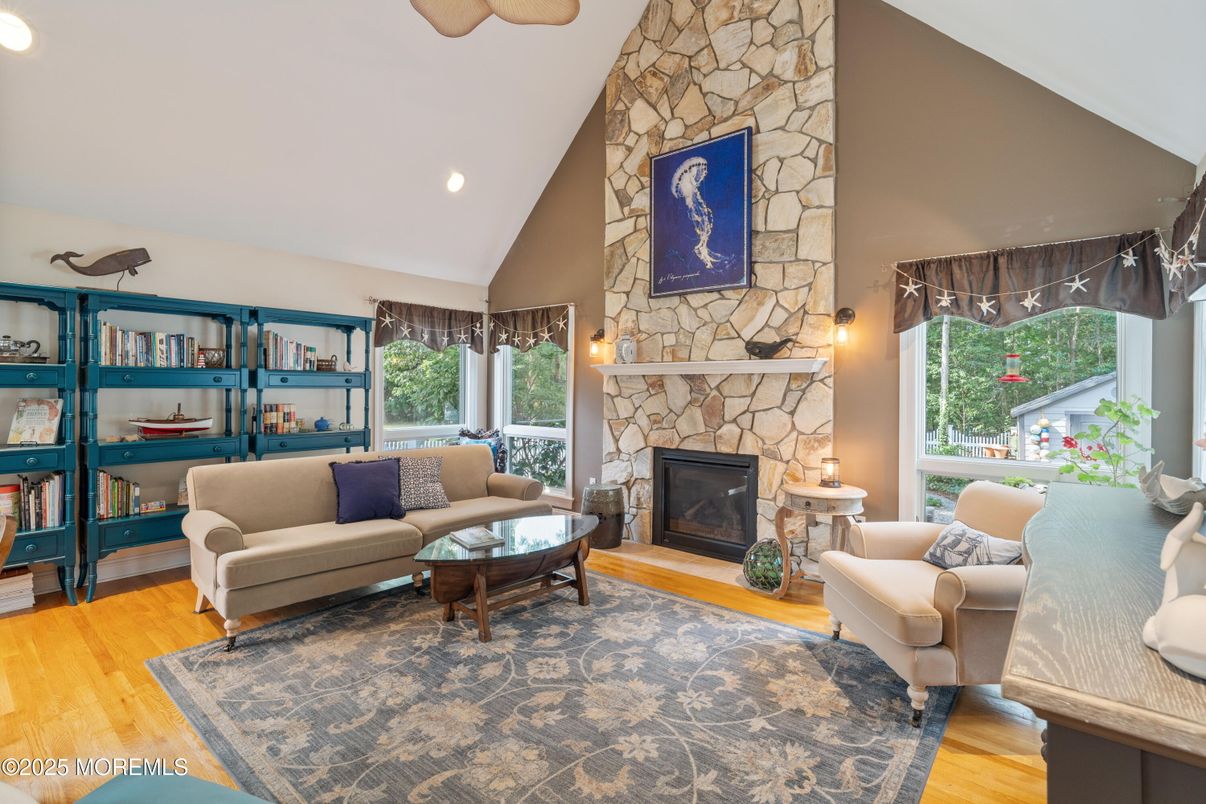 Fireplace, Interior, Living room, Recessed Lighting, Stone Walls, Wood Texture Flooring