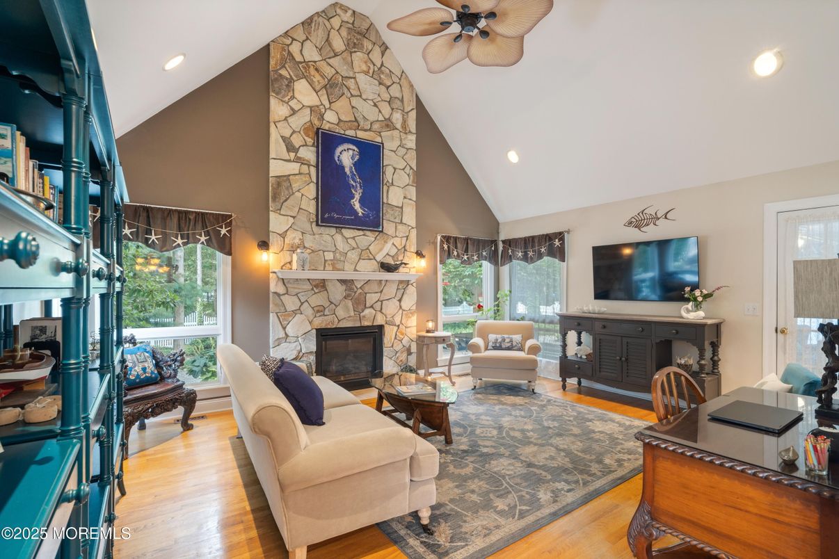 Fireplace, Interior, Living room, Recessed Lighting, Stone Walls, Wood Texture Flooring