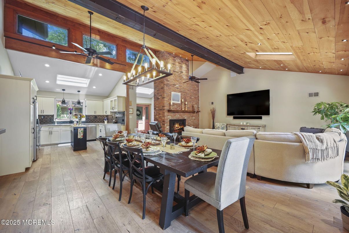 Dining room, Fireplace, Interior, Kitchen, Living room, Pendant Lights, Recessed Lighting, Stainless Steel Appliances, Stone Walls, Wooden Beams, Wooden Ceilings, Wood Texture Flooring
