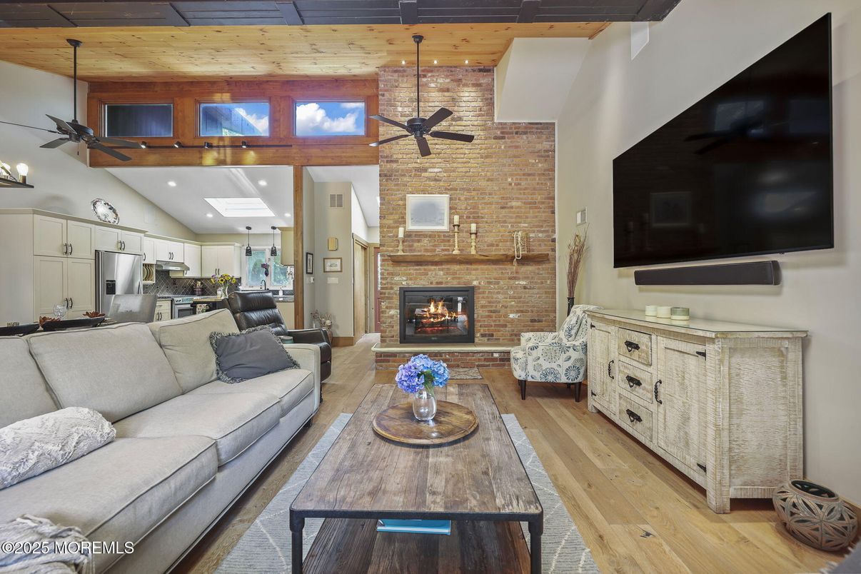 Fireplace, Interior, Kitchen, Living room, Recessed Lighting, Stainless Steel Appliances, Stone Walls, Wooden Beams, Wooden Ceilings, Wood Texture Flooring