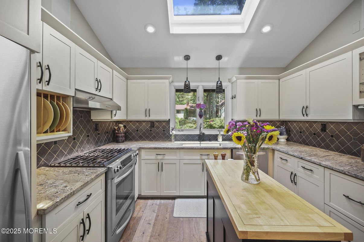 Glass Ceilings, Interior, Kitchen, Pendant Lights, Recessed Lighting, Stainless Steel Appliances, Wood Texture Flooring