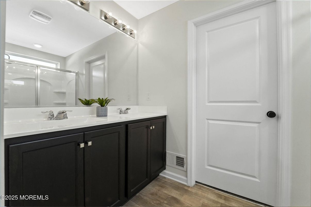 Bathroom, Dual Sink Vanities, Glass Shower, Interior, Recessed Lighting, Wood Texture Flooring