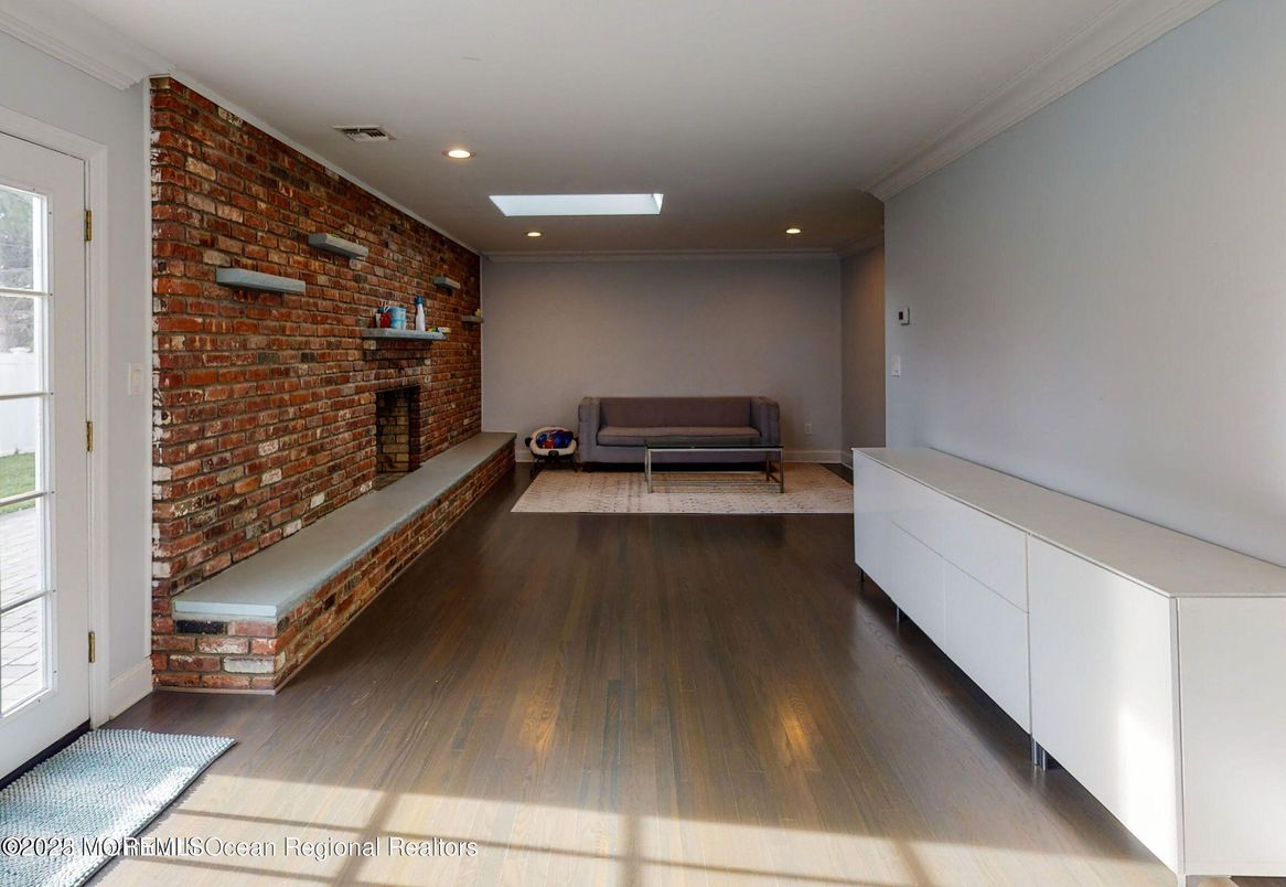 Fireplace, Interior, Living room, Recessed Lighting, Stone Walls, Wood Texture Flooring