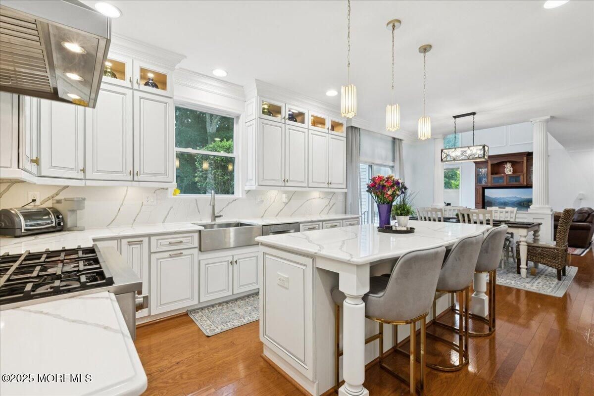 Dining room, Interior, Kitchen, Pendant Lights, Recessed Lighting, Stainless Steel Appliances, Wood Texture Flooring