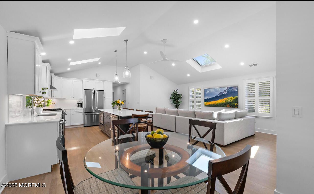 Dining room, Interior, Kitchen, Living room, Pendant Lights, Recessed Lighting, Stainless Steel Appliances, Wood Texture Flooring