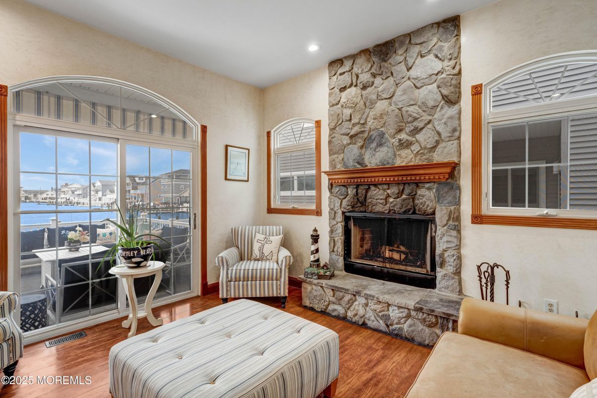 Fireplace, Interior, Recessed Lighting, Stone Walls, Water, Wood Texture Flooring