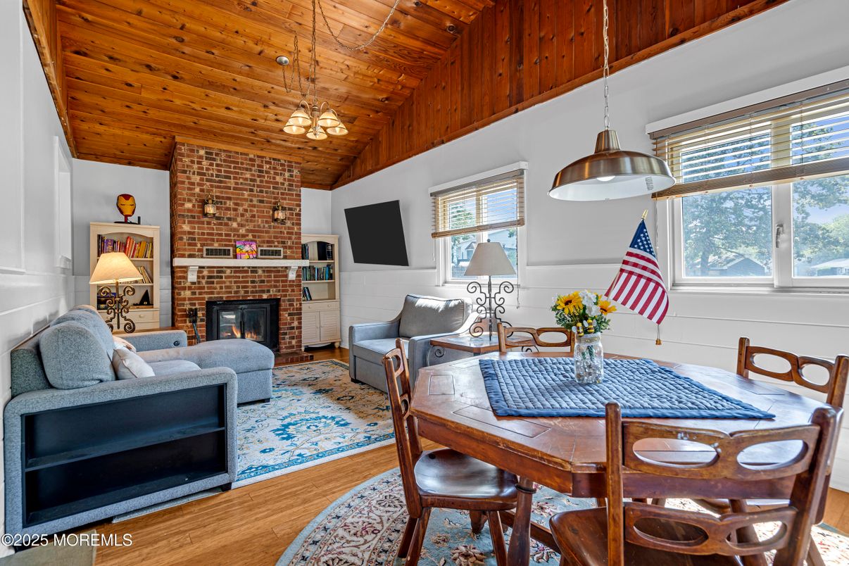 Dining room, Fireplace, Interior, Living room, Pendant Lights, Stone Walls, Wooden Ceilings, Wood Texture Flooring
