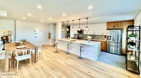 Dining room, Interior, Kitchen, Pendant Lights, Recessed Lighting, Stainless Steel Appliances, Wood Texture Flooring