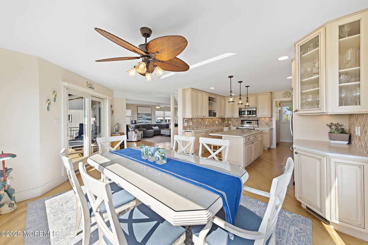 Dining room, Interior, Kitchen, Living room, Recessed Lighting, Stainless Steel Appliances, Wood Texture Flooring