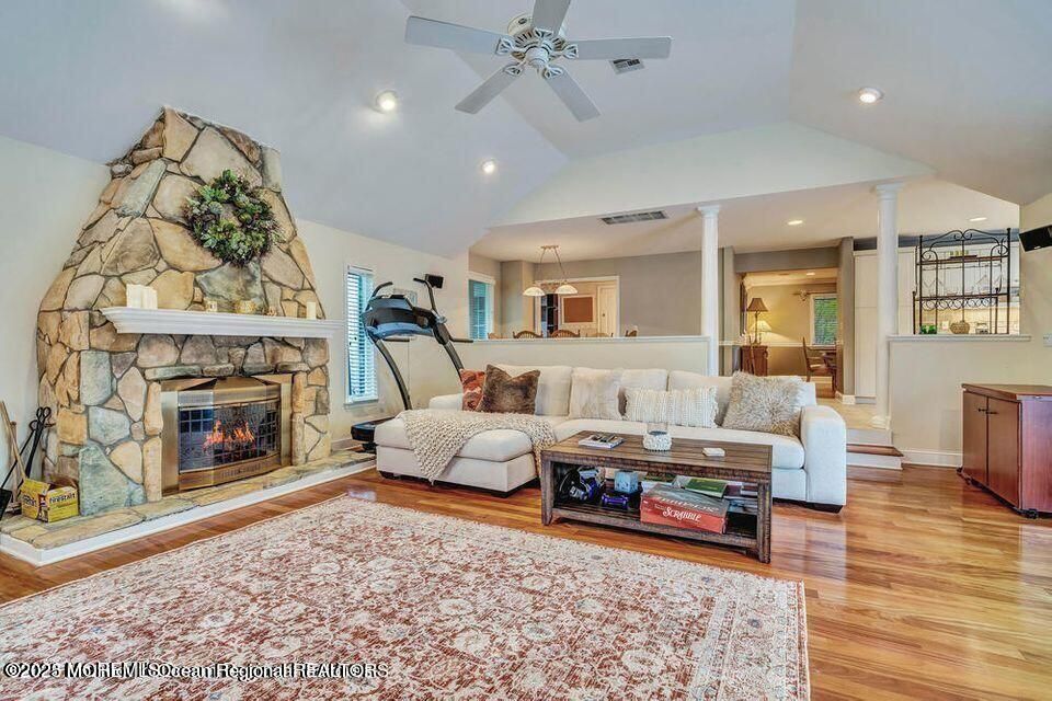 Fireplace, Interior, Living room, Recessed Lighting, Stone Walls, Wood Texture Flooring